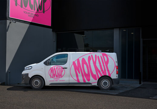 Delivery van is parked beside a storefront business. Billboard available. Corporate image with two spaces for your design