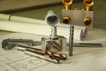 Precision engineering tools and components arranged on blueprints, showcasing innovative design and...