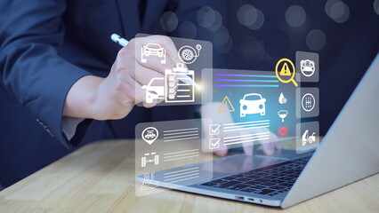Customer service concept Car service and checking concept. Hand of a mechanic with laptop for maintenance checklist vehicle.Software for manager check to repair, technology checkup automotive.