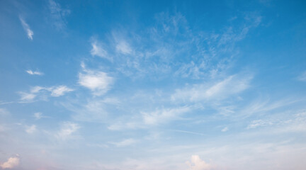 the sky is full of fluffy white clouds, bright and beautiful, no one else is there.