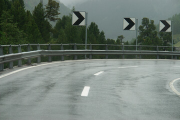 Road with a white line and a black arrow on it