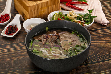Vietnamese Pho Bo soup with beef and noodles