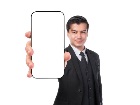 Confident businessman in black suit showing smartphone with blank screen towards camera, promoting app or digital content, isolated on a transparent background, close-up hand focus - Powered by Adobe