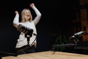 Podcaster dancing and laughing during a recording session