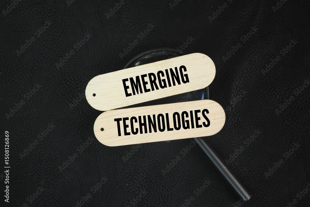 Poster magnifying glass and stick with the word emerging technologies. new or rapidly evolving technologica