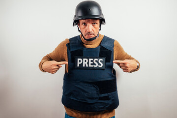 Reporter in bulletproof vest with a camera.