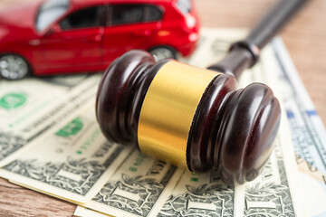 Hammer gavel judge and Euro banknote money with car vehicle accident, insurance coverage claim lawsuit court case.