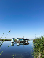 Old fishing scales on stilts in the quiet of the Tuscan swamp