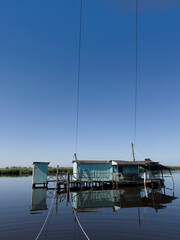 Old fishing scales on stilts in the quiet of the Tuscan swamp