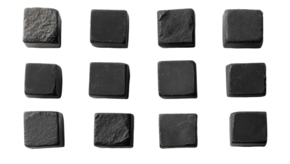 Twelve small, square, dark grey stone samples, showcasing varying textures and finishes, arranged in a grid