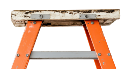 Close-up of a weathered, orange fiberglass stepladder's top, showing a dirty wooden platform secured by metal plates and bolts