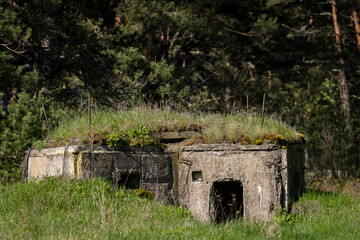 An old, concrete second world war bunker. Military heritage from World War II. Second world war...