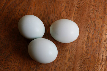Some duck salted eggs on wooden cutting board in the kitchen