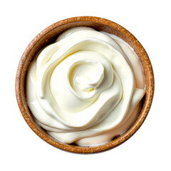 A top down view of a brown bowl filled with a thick white creamy substance on a black background