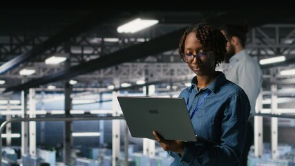 Data center software developers using devices to review AI LLM visualizations. IT professionals working together to analyze neural networks outputs, ensuring stable gear operations