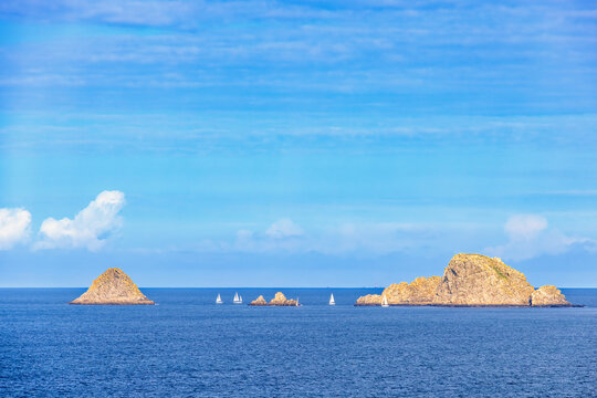 Sailboats at a skerry coast and a open sea view