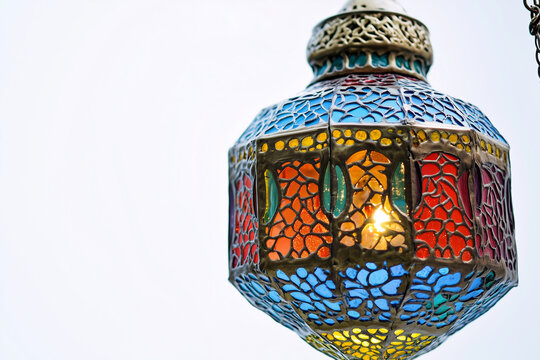 Colorful Moroccan lanterns with mosaic glass on a white background