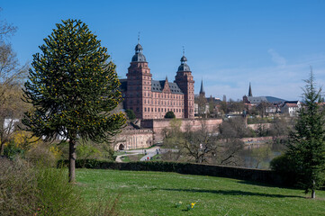 Aschaffenburg Castle with a river and a blue sky.