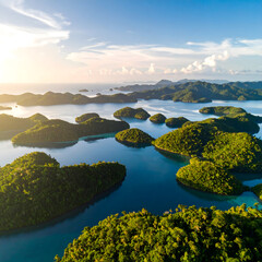 Naklejka premium Tropical Island Paradise Lush Green Islands Turquoise Waters Aerial View at Sunset