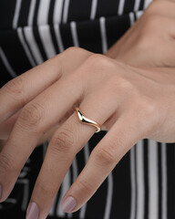 golden finger ring for women isolated image