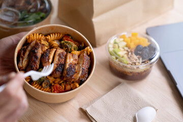 Close up paper bowl with healthy food on work place of working desk, Healthy eating clean food habits for diet and health care concept, Delicious balanced food concept.