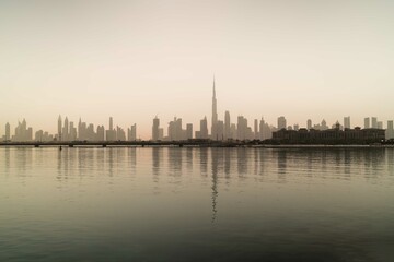 Skyline of Dubai reflecting in the water