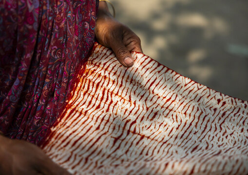 Shawl made with red tie-dye resist dyeing technique in Living Blue, Rangpur Division, Goalpara, Bangladesh