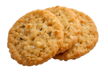 Close up view of three round savory crackers with herbs and cheese on black background