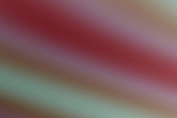 Multicolored abstract gradient background with red pink and green hues creating warm atmospheric...
