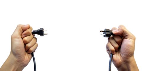 Two hands holding electrical plugs isolated on a white background