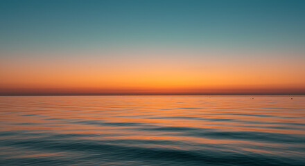 Fototapeta premium Serene Ocean Sunset Calm Waters and Vibrant Sky at Golden Hour