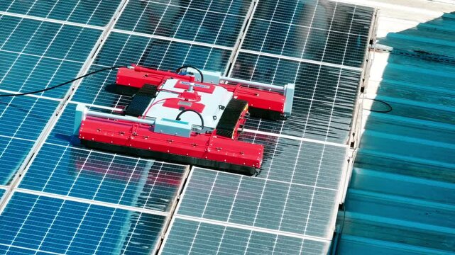 Robot cleans solar panels - 4k drone footage of robot cleaning solar panels