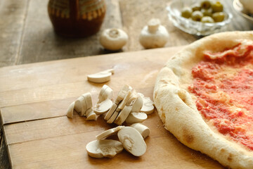 Making pizza with cremini. Sliced mushrooms for pizza on table