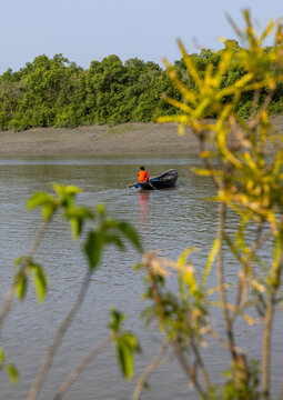 Man on a canoe on a river, Khulna Division, Mongla, Bangladesh