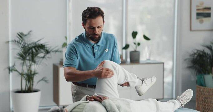 Legs, rehabilitation or stretching with patient and physiotherapist in office for assessment. Health, injury or medical with chiropractor and man in session for accident, emergency or recovery