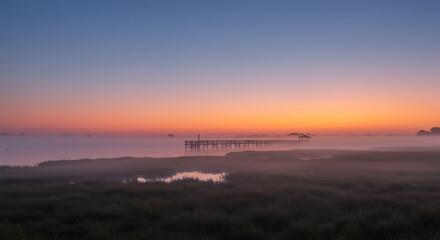 Serene Sunrise over Misty Marsh Landscape with Pier and Gazebo