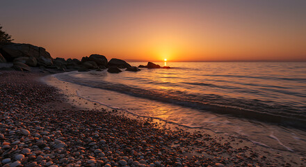 Stunning Seascape Sunrise over Rocky Beach with Seashells