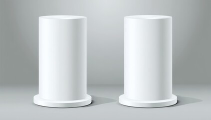 Two white cylindrical display stands on gray background