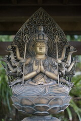 Fototapeta premium Serene Bronze Sculpture Eleven-Headed Kannon Bodhisattva Statue