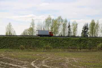 Obraz premium A truck is driving on the road,