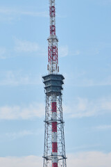 A Telecommunications Tower Stands Tall Against the Clear Blue Sky Above, Punctuating the Landscape