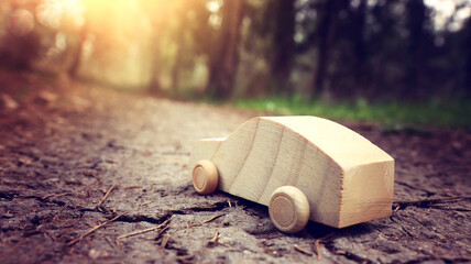 Concept image of wooden car in nature. Idea of clean transportation and environment