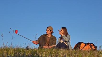 Couple Taking Selfie Outdoors in a Scenic Field