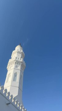 Birds Flying Among Quba Mosque Domes Under Clear Blue Sky of Madinah