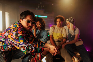 Stylish friends socializing outdoors.