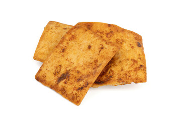 Nacho chips texture. Tortilla chips. Taco chips. Close-up. Food background. Tasty snack. Group of crispy corn chips isolated on white background.