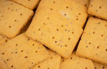 Cereal crackers with flax and sesame seeds isolated on white. Dry salted cracker cookies.Stack of various crispy wheat, rye and corn tortillas with sesame and sunflower seeds on white background