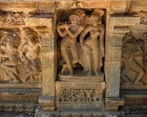 Lord Krishna and Radha, stone sculpture. Picture clicked at Dharasuram Sri Airavatesvara Temple, Tamil Nadu, India. After 900 years, it remains a key surviving example of Chola architecture