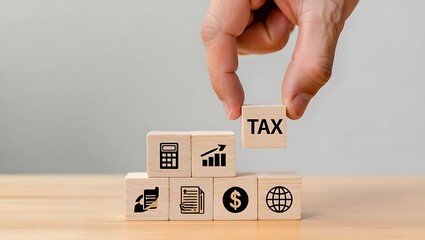 Hand placing TAX block on wooden cubes showcasing global finance, growth, and accounting concepts.