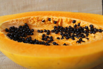Close-up of ripe papaya fruit cut in half